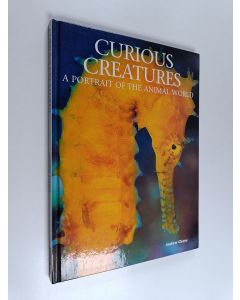 Kirjailijan Andrew Cleave käytetty kirja Curious Creatures - A Portrait of the Animal World