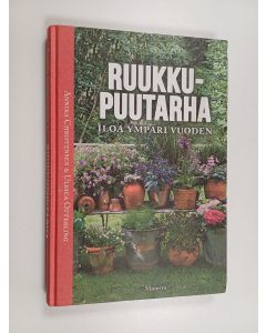 Kirjailijan Annika Christensen käytetty kirja Ruukkupuutarha : iloa ympäri vuoden