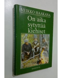 Kirjailijan Veikko Haakana käytetty kirja On aika sytyttää kiehiset : eräjutelmia