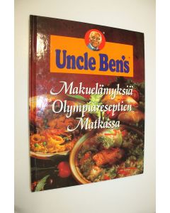 Kirjailijan Michele Olivier käytetty kirja Makuelämyksiä olympiareseptien matkassa