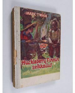 Kirjailijan Mark Twain käytetty kirja Huckleberry Finnin seikkailut