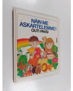 Kirjailijan Outi Paasi käytetty kirja Näin me askartelemme! : uusia ilmaismateriaaleihin perustuvia askarteluohjeita kodeille, päiväkodeille ja lastentarhoille